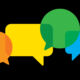 Vector illustration of multi-colored speech bubbles against a black background in flat style.