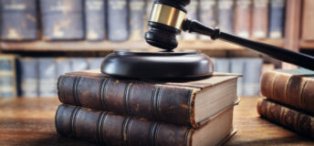 Judge gavel and law books in court, law and justice background concept