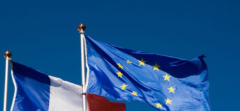 Flags of the European Union and France flying in the wind
