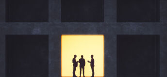 Businessmen talking in secrecy.