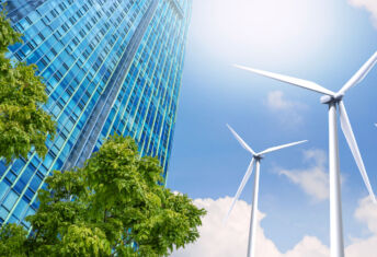 IMCO: Focusing on the clean energy transition Modern high-rise buildings are powered by wind turbines. and the fresh air from the trees
