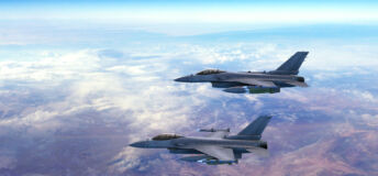 Two fighter jets flying together above clouds over Europe