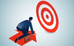 Photo of a person on an arrow that is moving toward a target.