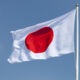 Japan’s asset owner principles notch more than 300 signatories Flag of Japan on a windy day.