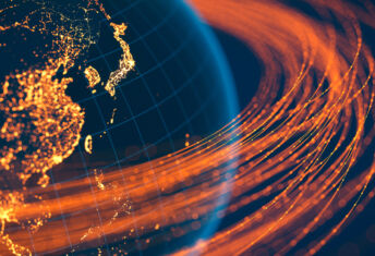 Global development capital illustrated by lines of light orbiting the globe