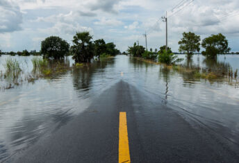 The long road ahead: Investors grapple with physical climate risk assessment A partially flooded road